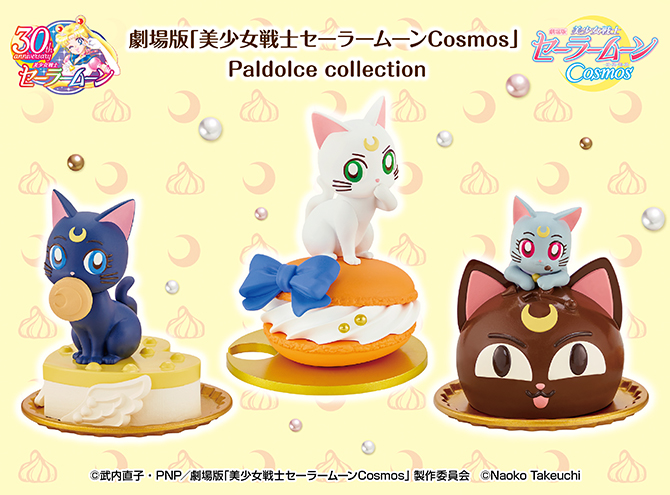 figurki kotów siedzących na słodkościach